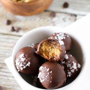 Gluten Free Vegan Salted Chocolate Peanut Butter Truffles. 3-ingredient creamy peanut butter truffles, coated in chocolate and a sprinkling of sea salt flakes.